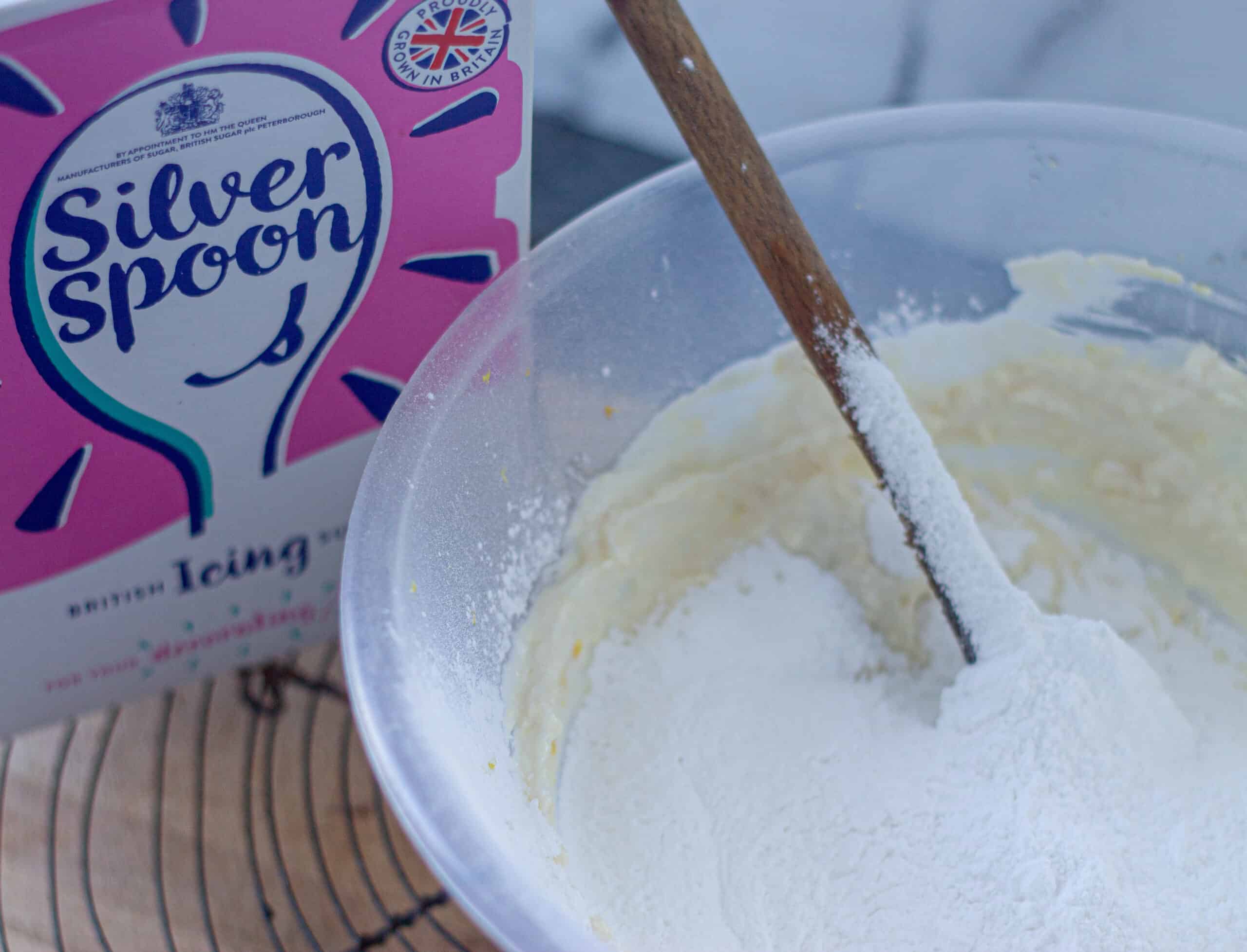 Icing sugar added to cream cheese icing