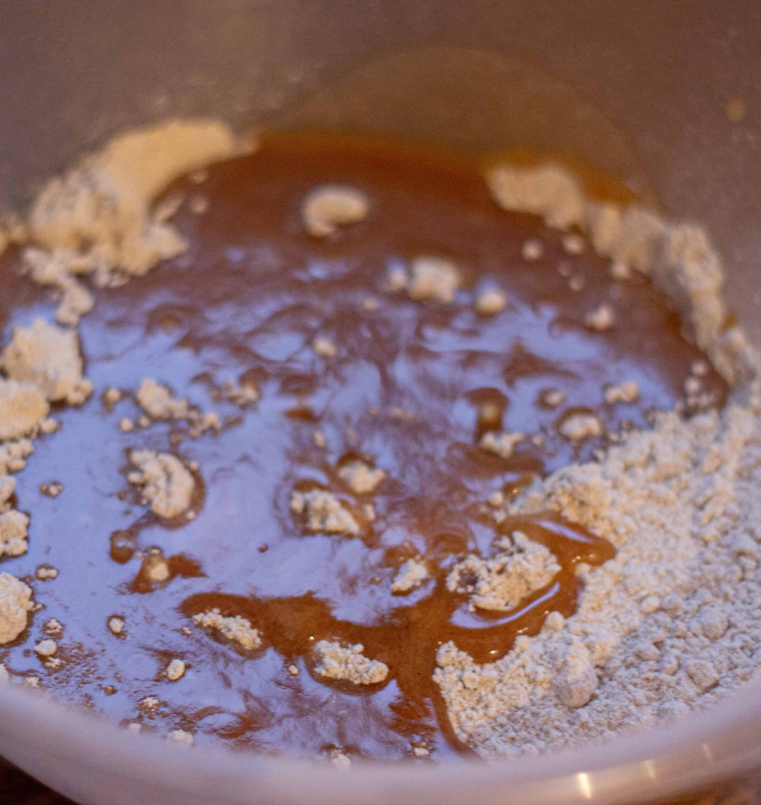 Adding flour to cookie mixture