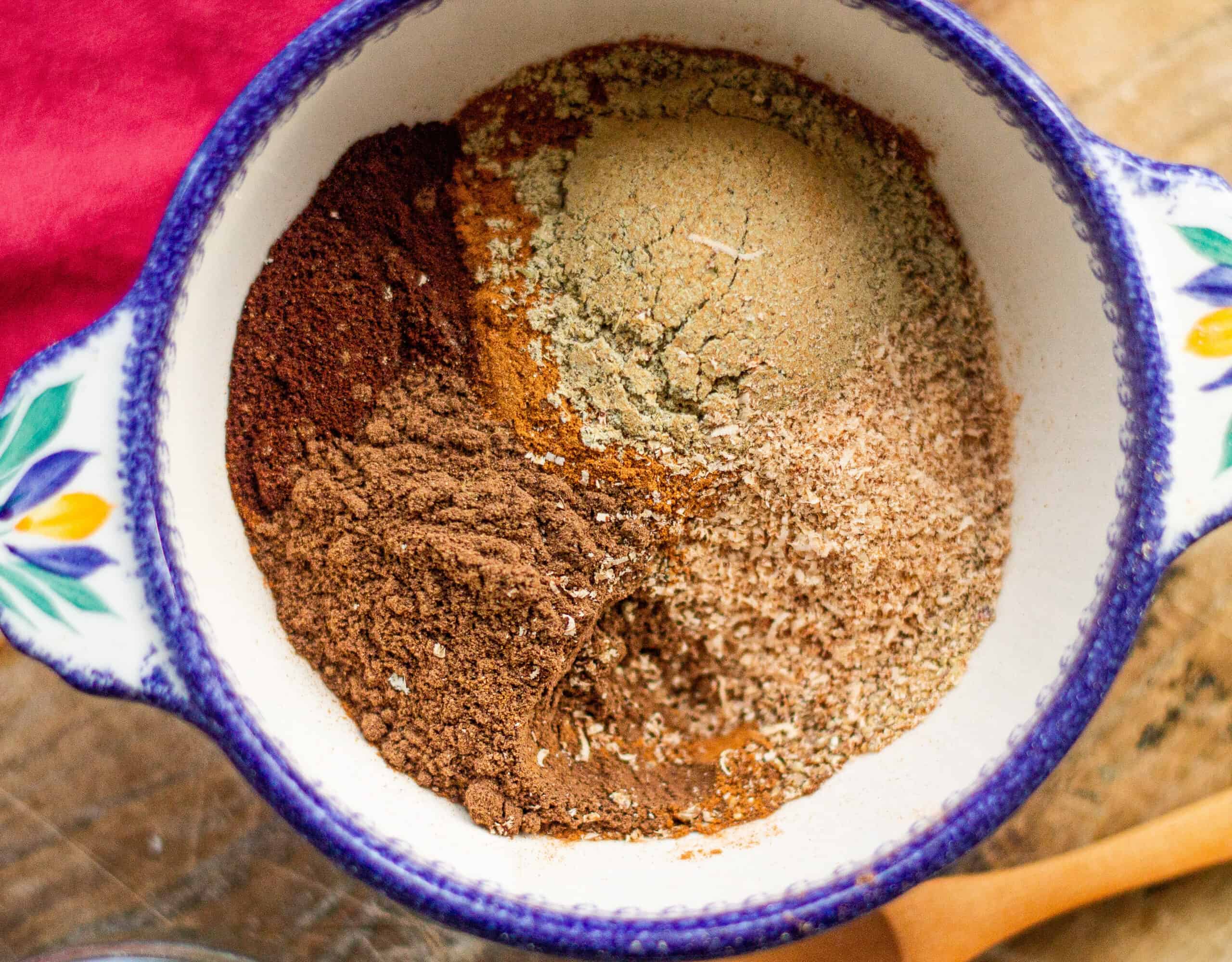 Ingredients for chai powder in a bowl