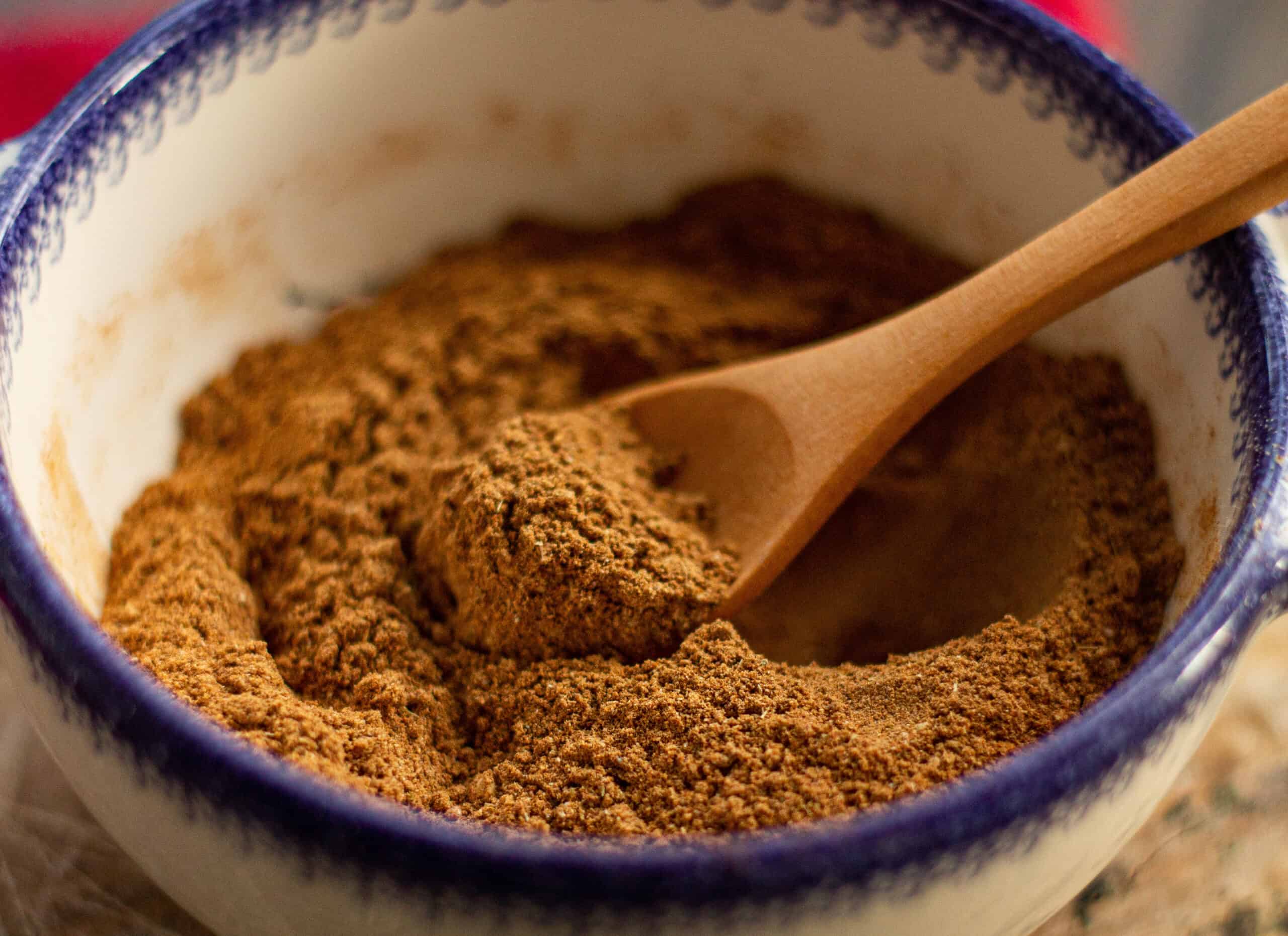 Mixing chai spices in a bowl