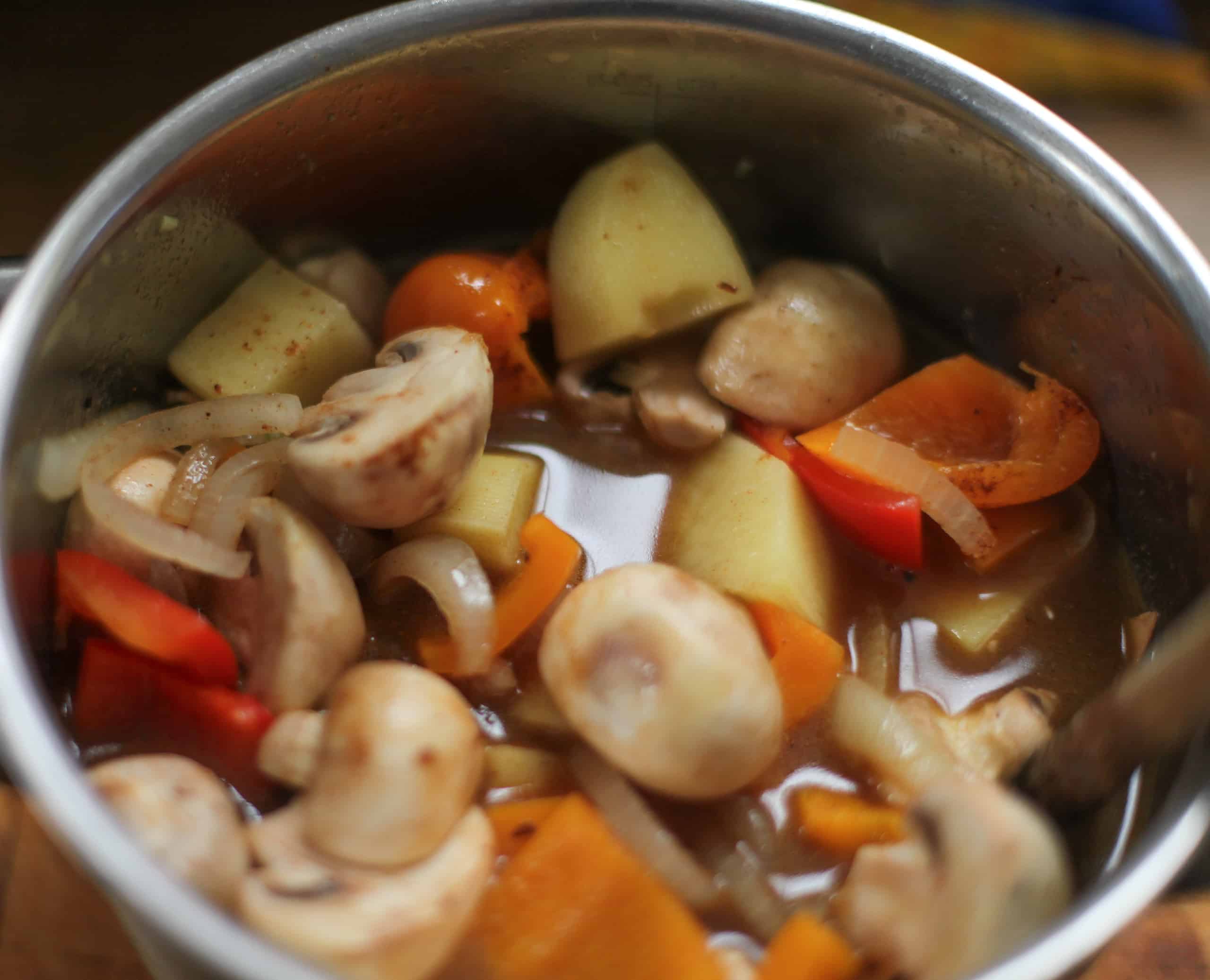 Covering goulash ingredients with water