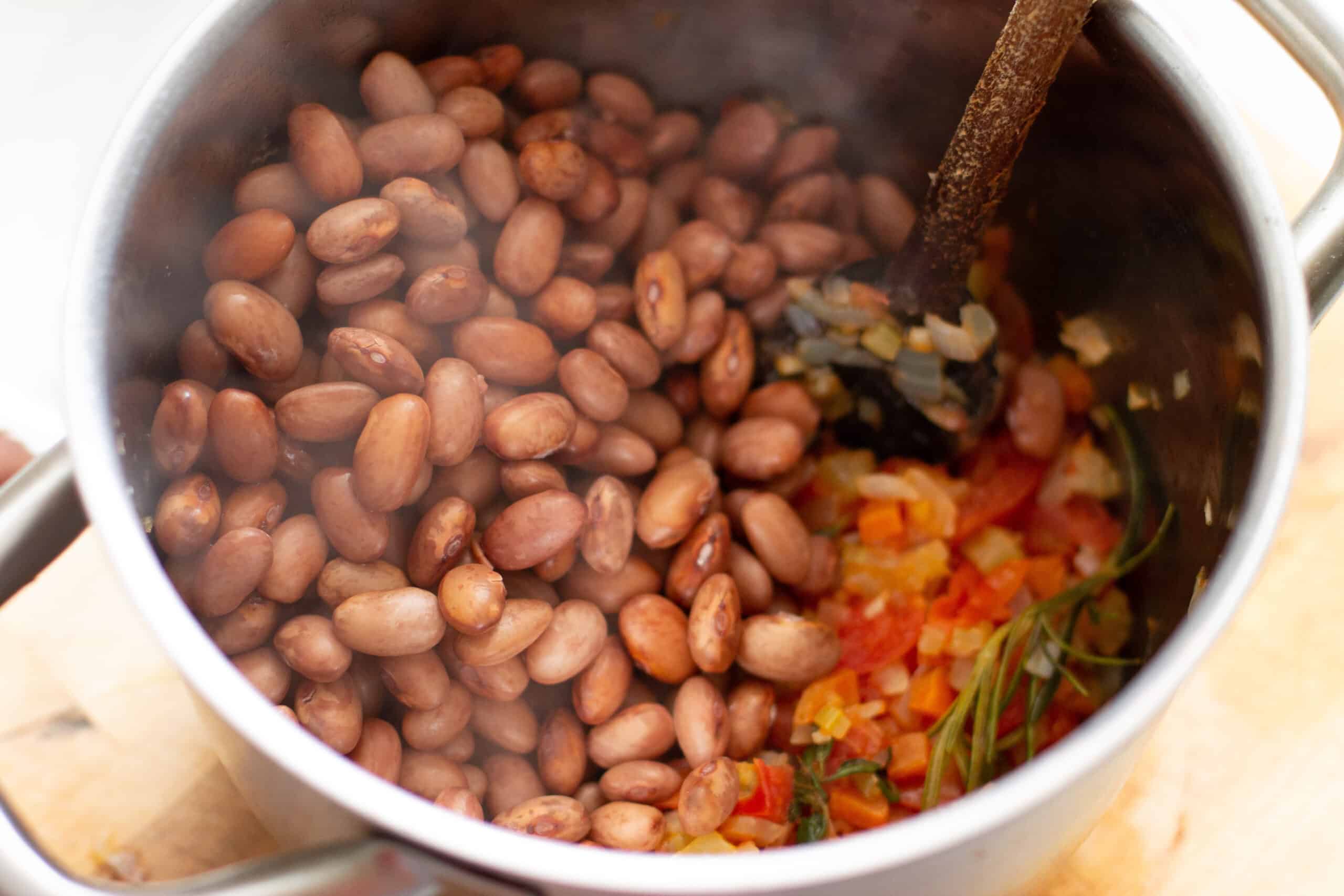 Adding beans to soffritto
