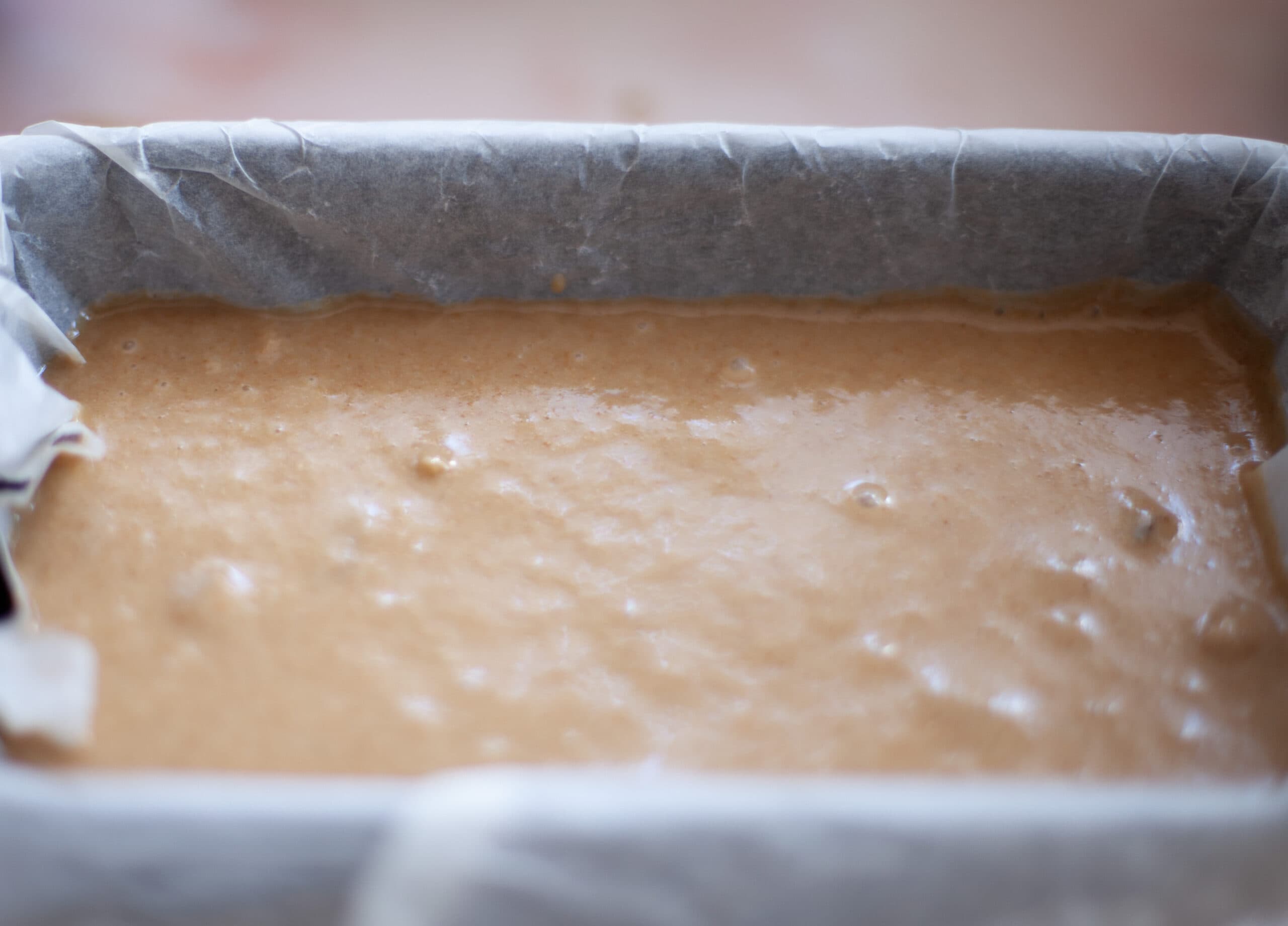 Pouring batter into loaf tin