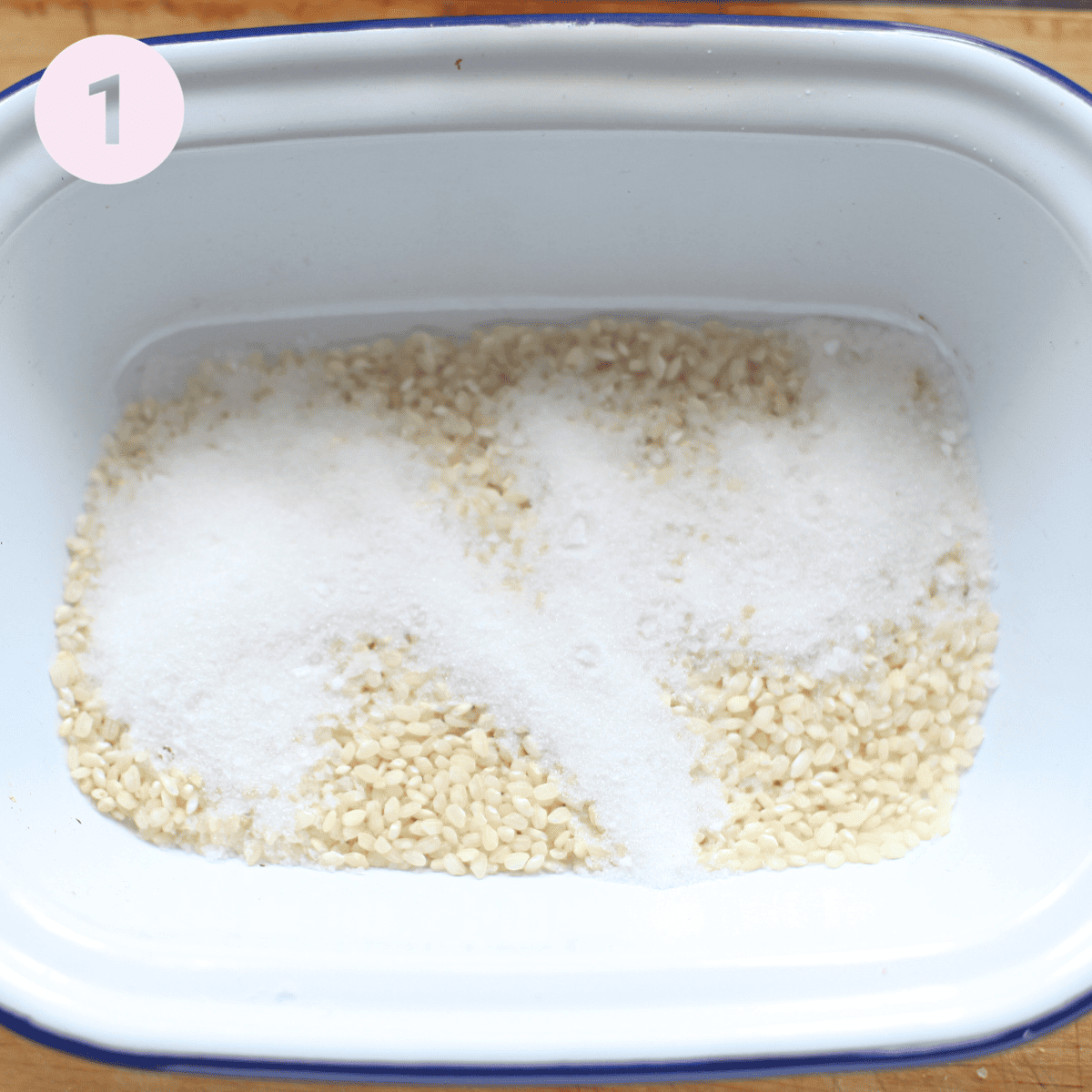 Adding rice to a baking dish.