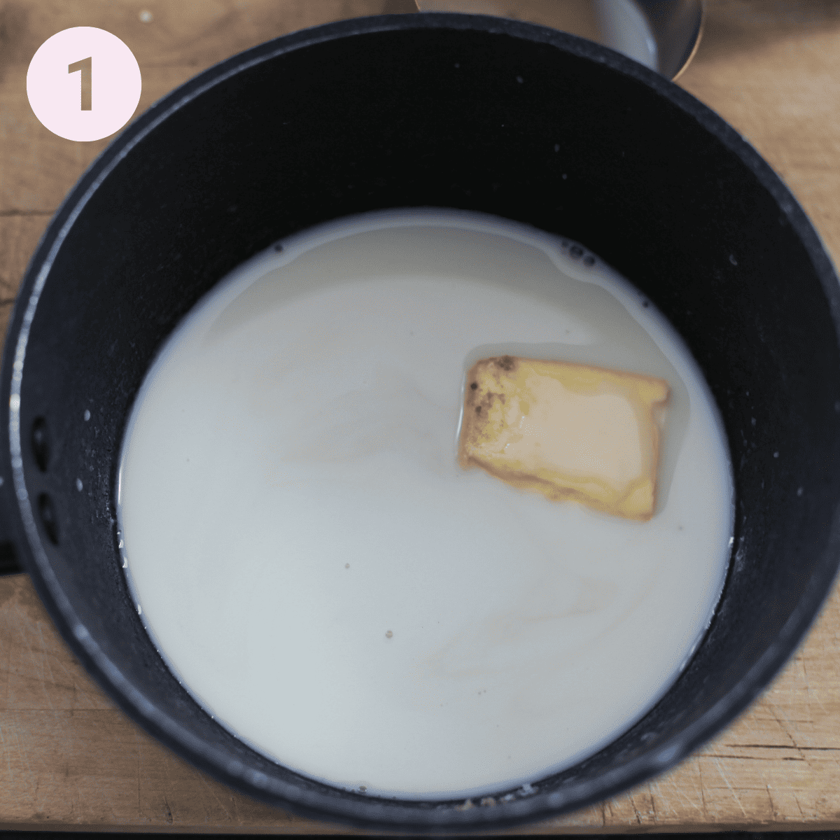 Melting  butter and milk in a pan.