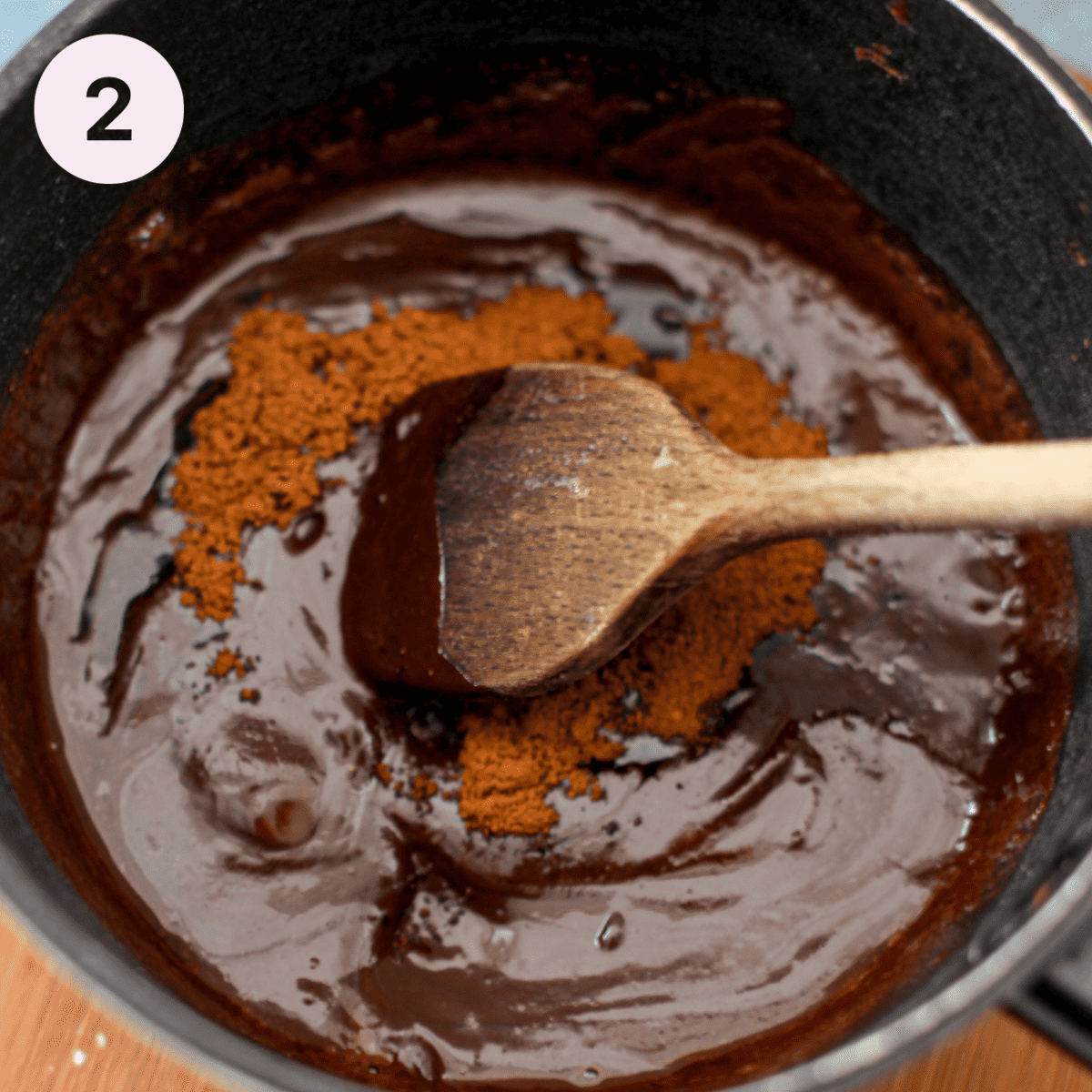 Stirring espresso powder in melted chocolate.