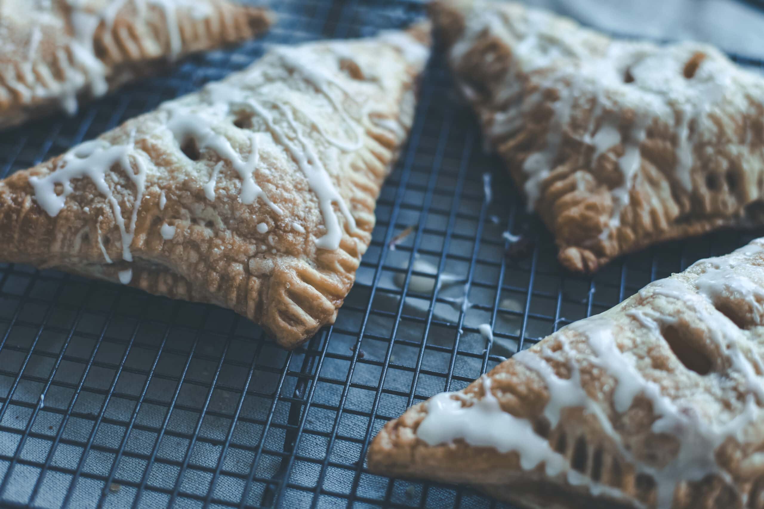 Apple turnovers on a cooling rack.