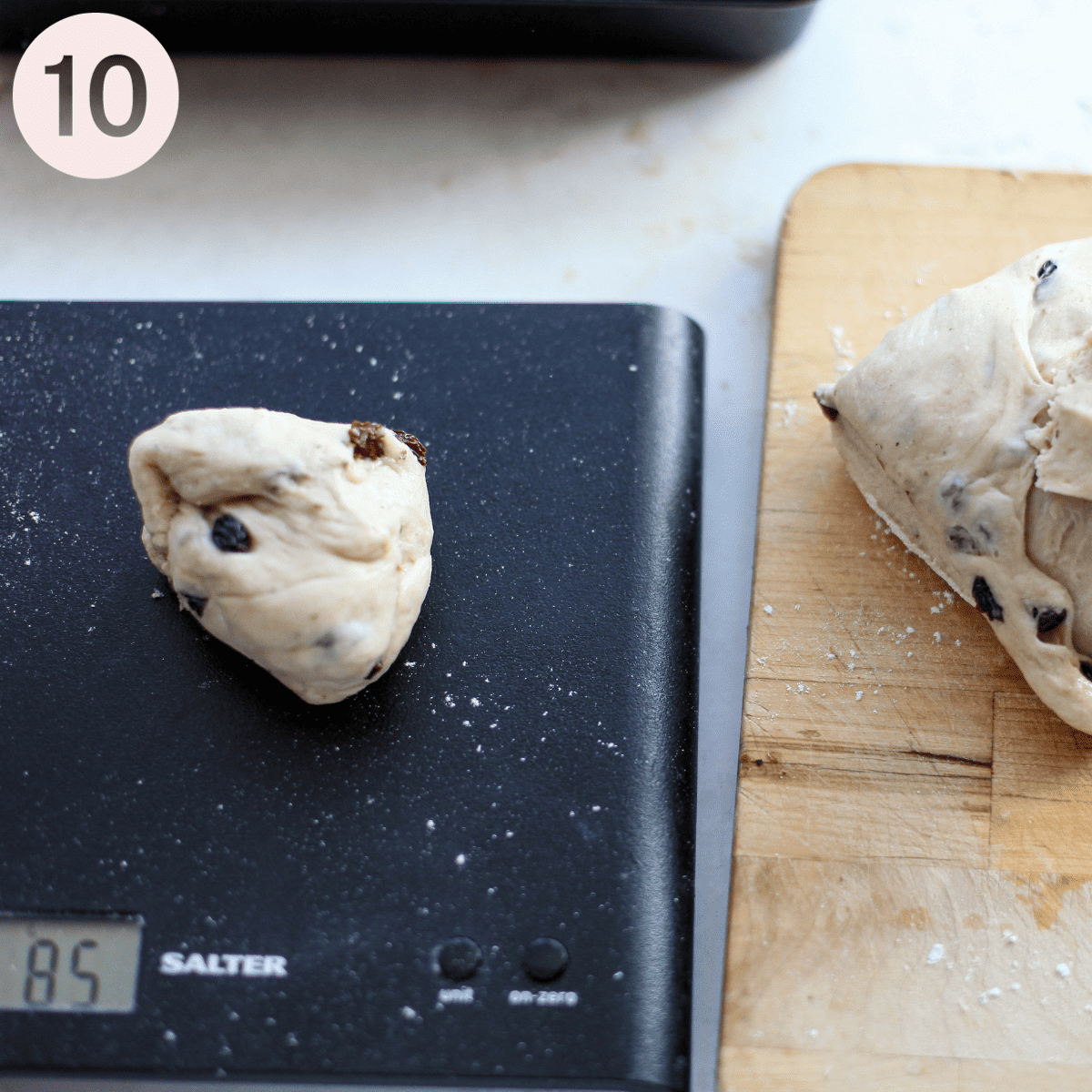 Weighing individual dough buns.
