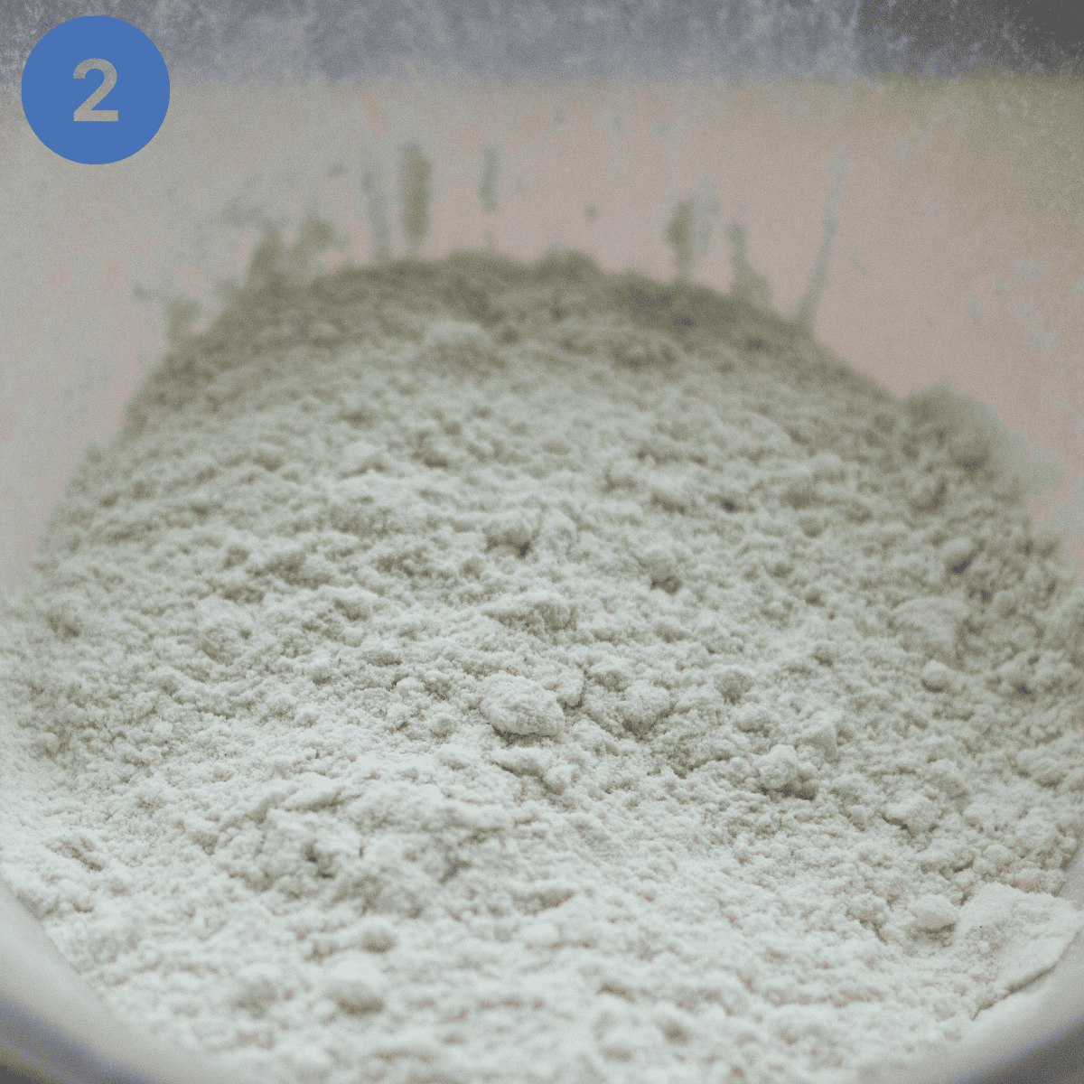 Rubbing the lard into the flour.