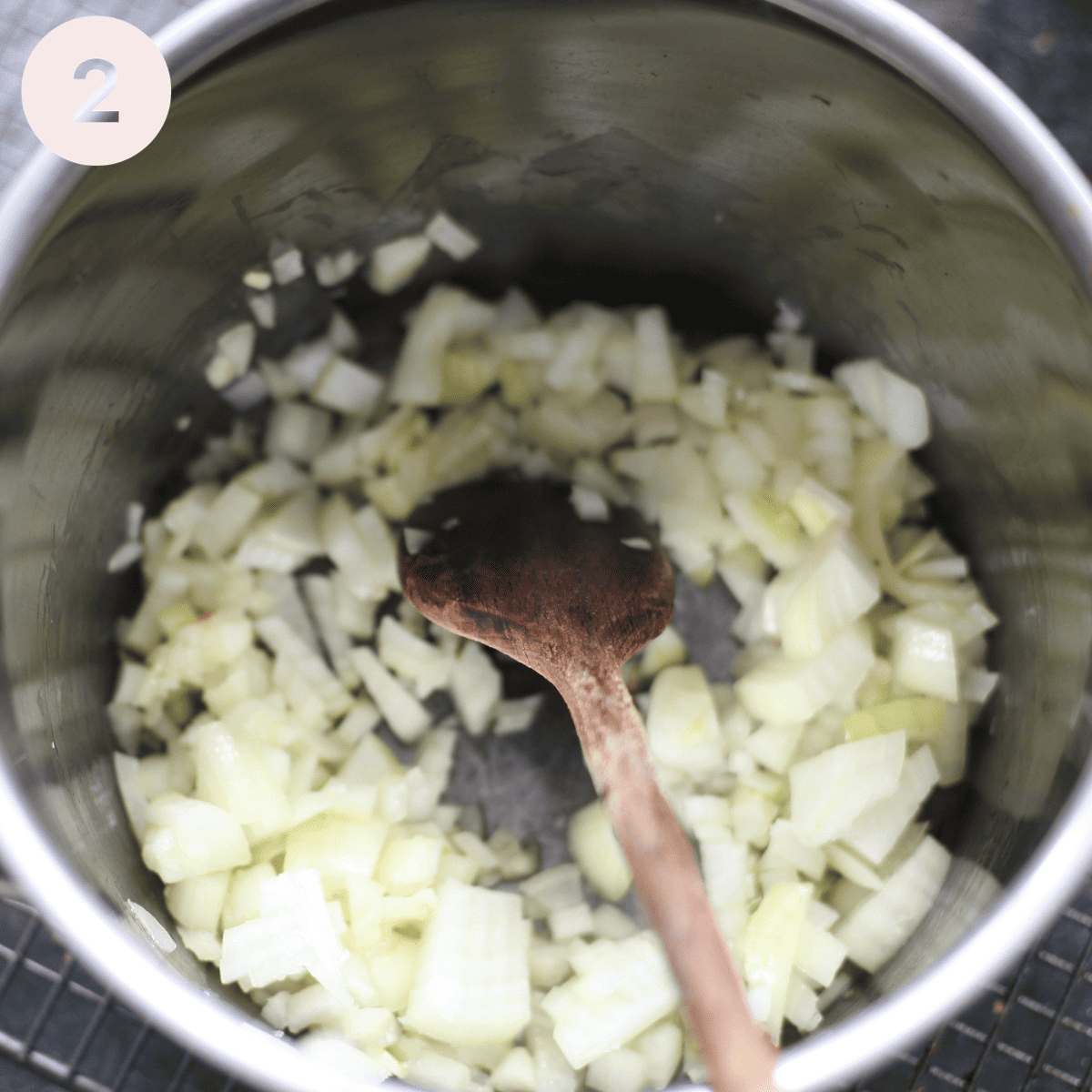 Sauteeing onion in a pan.
