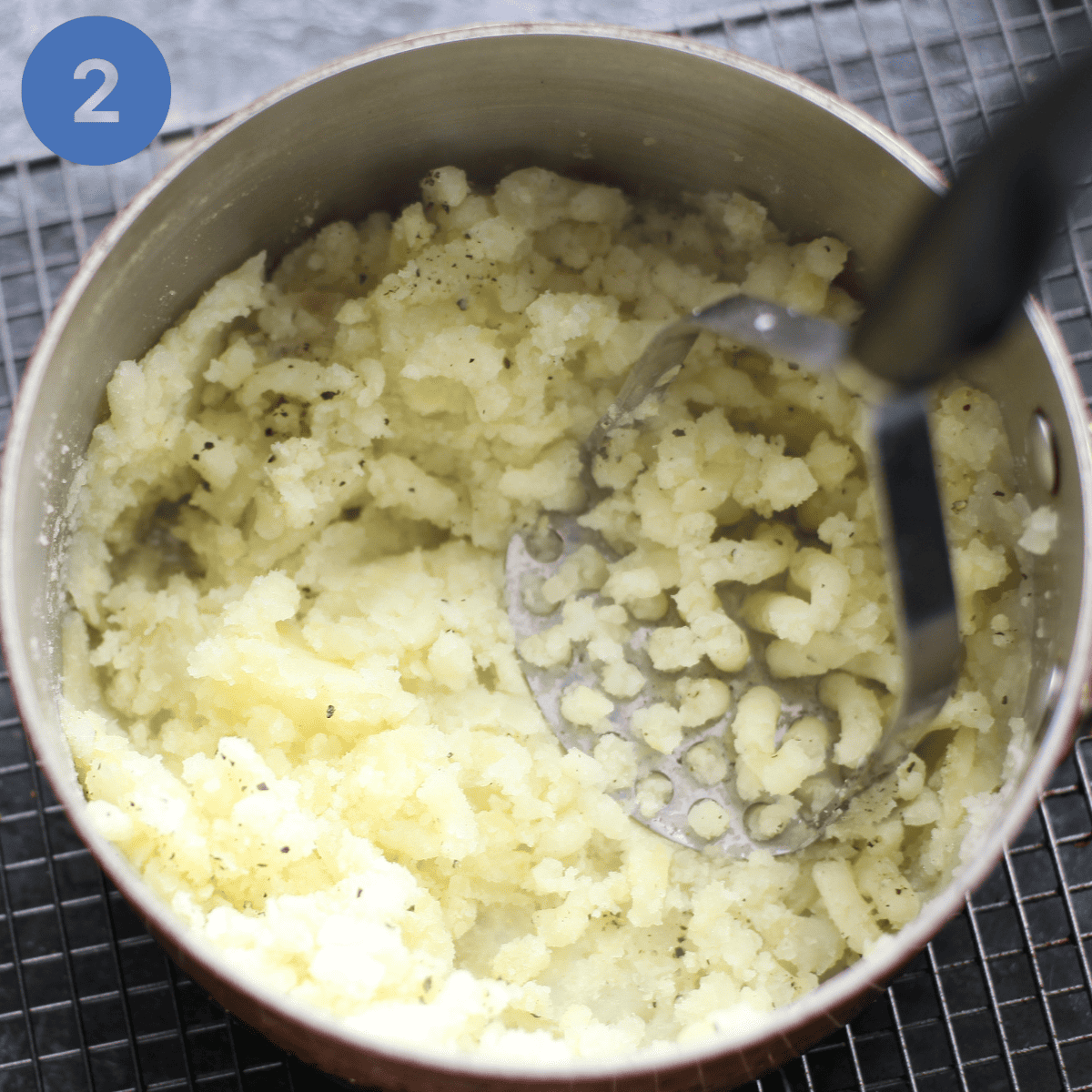 Mashing potato.