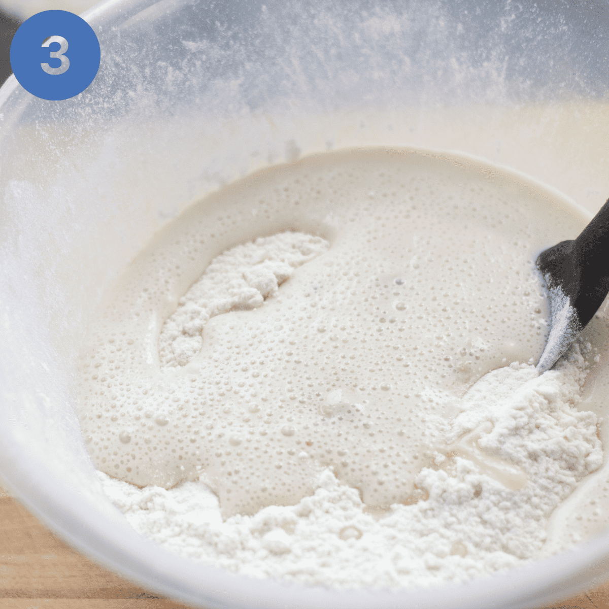 Adding yeast to flour.