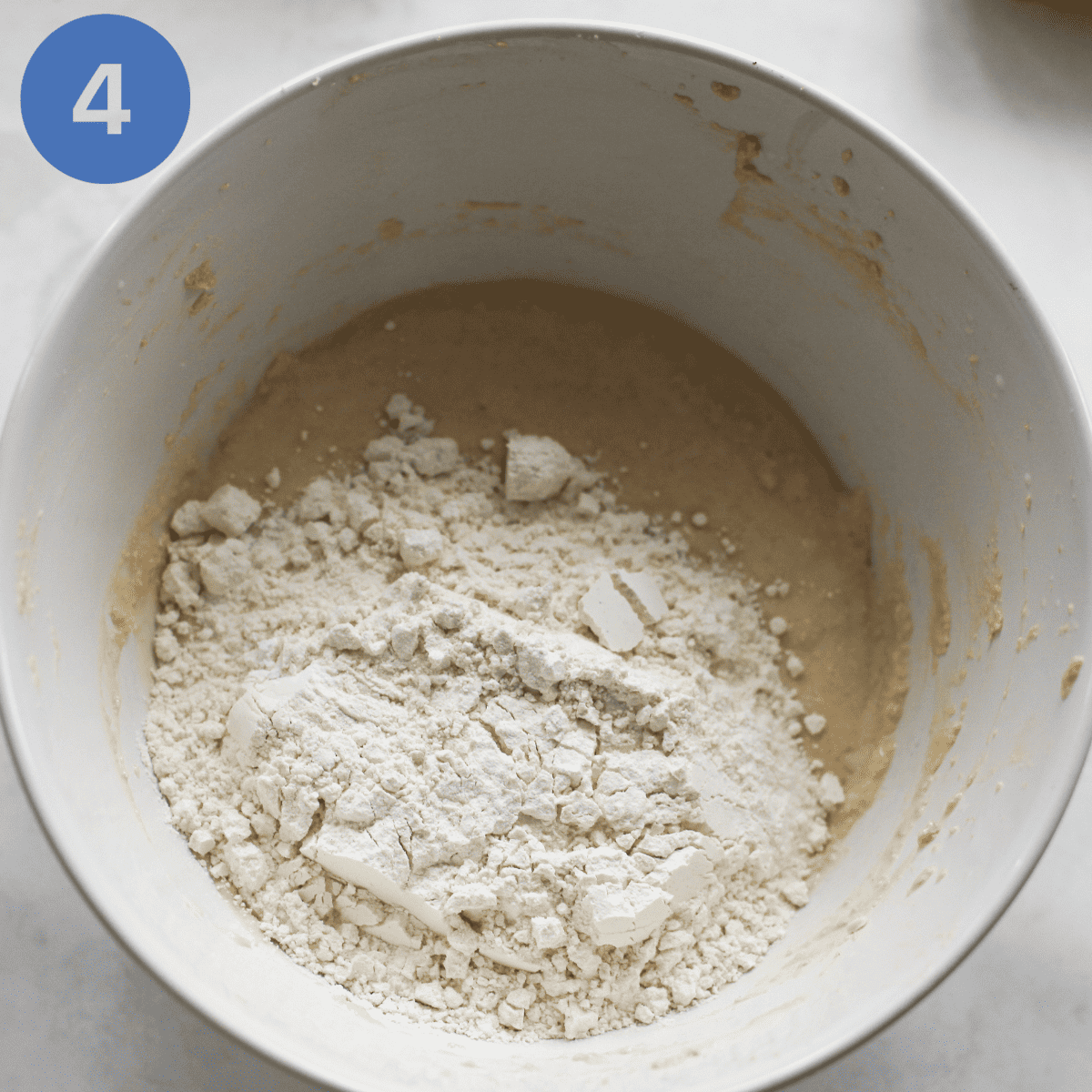 Sifting in flour to cake batter.