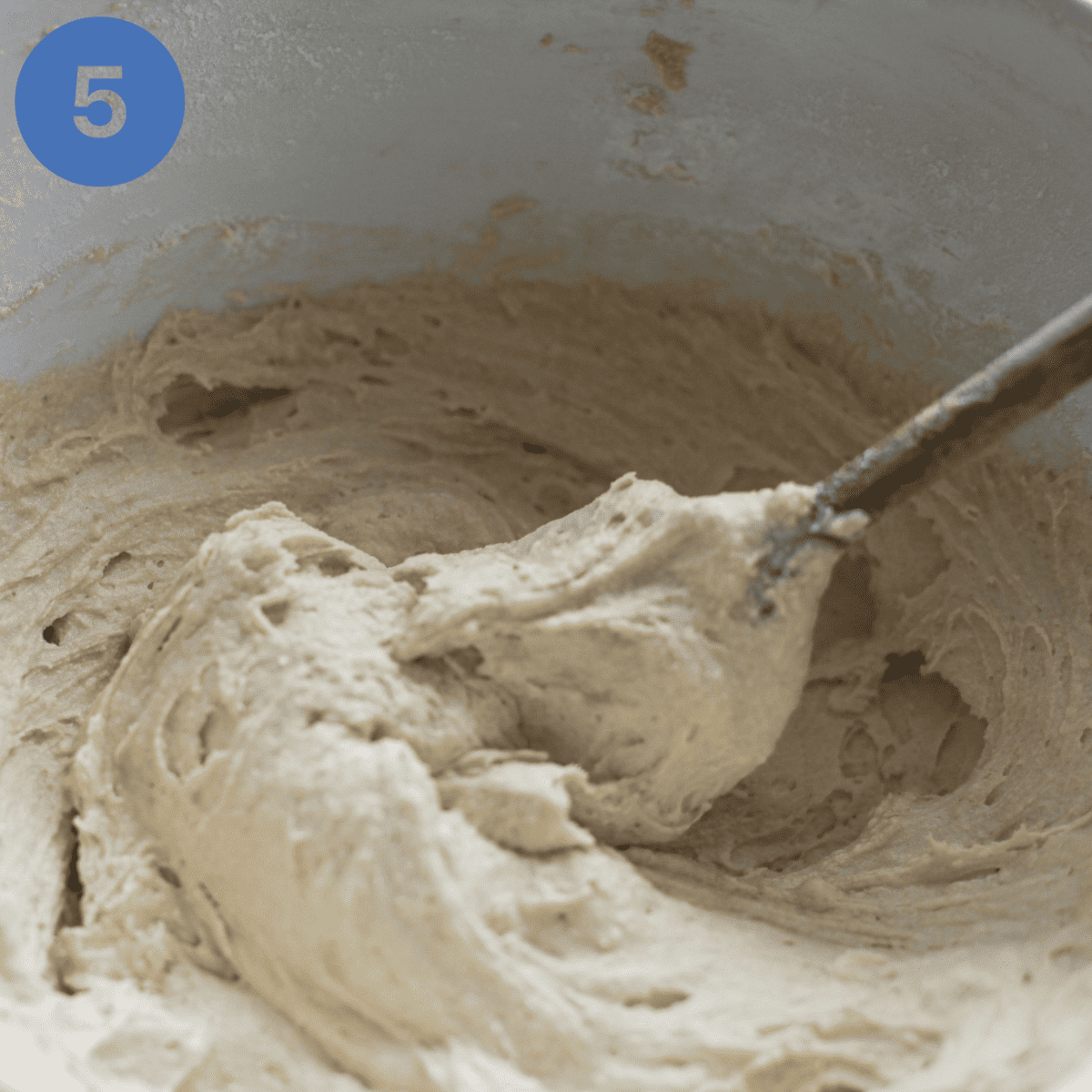 Mixing cake mixture until smooth.