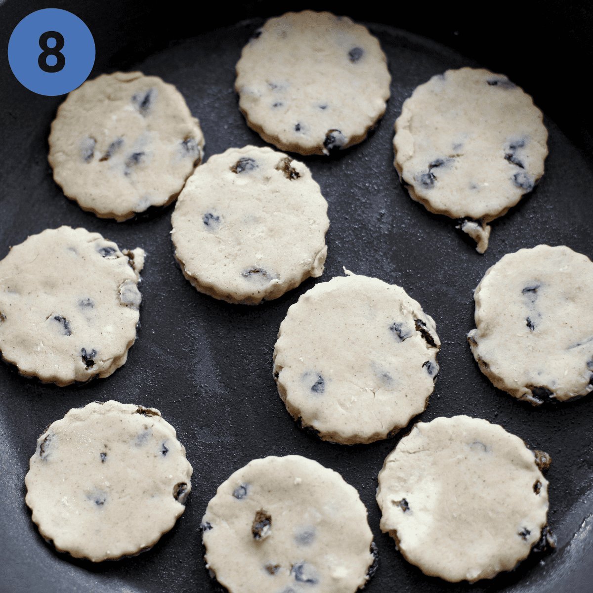 Cooking Welsh cakes in frying pan.