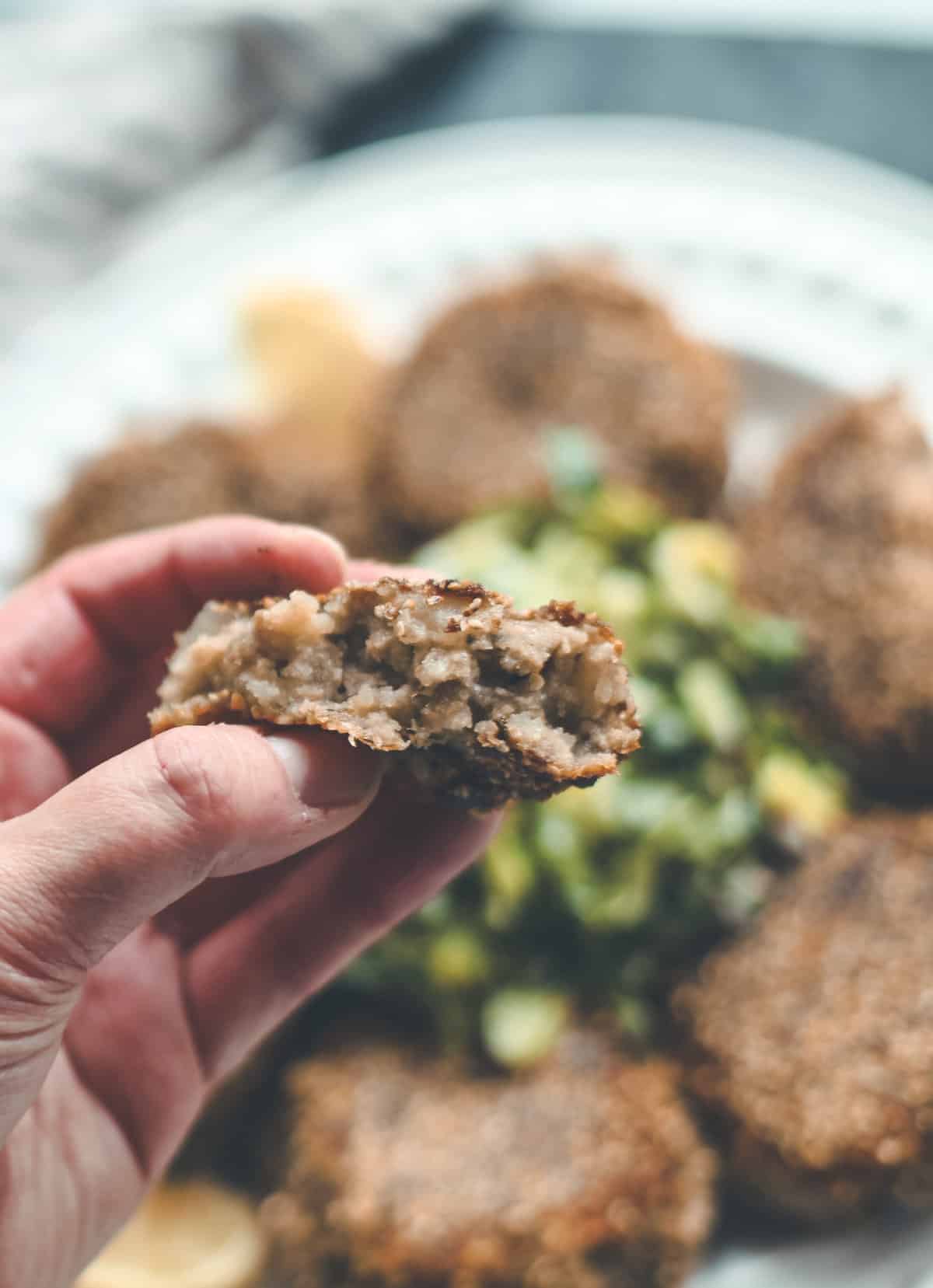 Holding a haggis fritter.