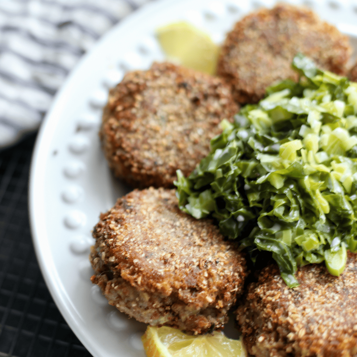 A plate of haggis fritters and shredded cabbage.