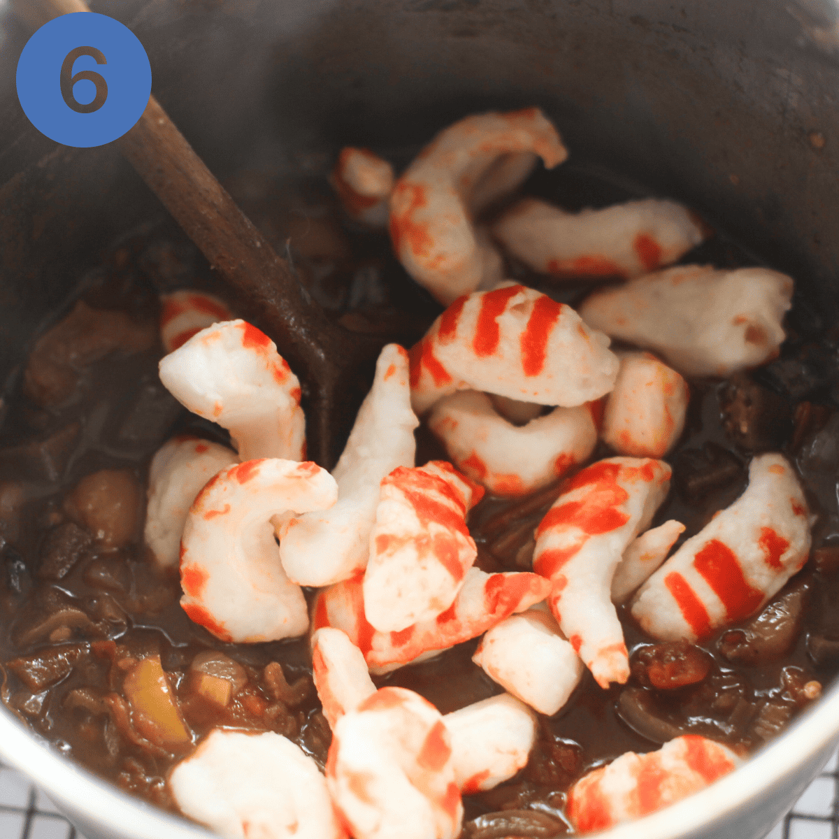 Adding vegan prawns to creole.