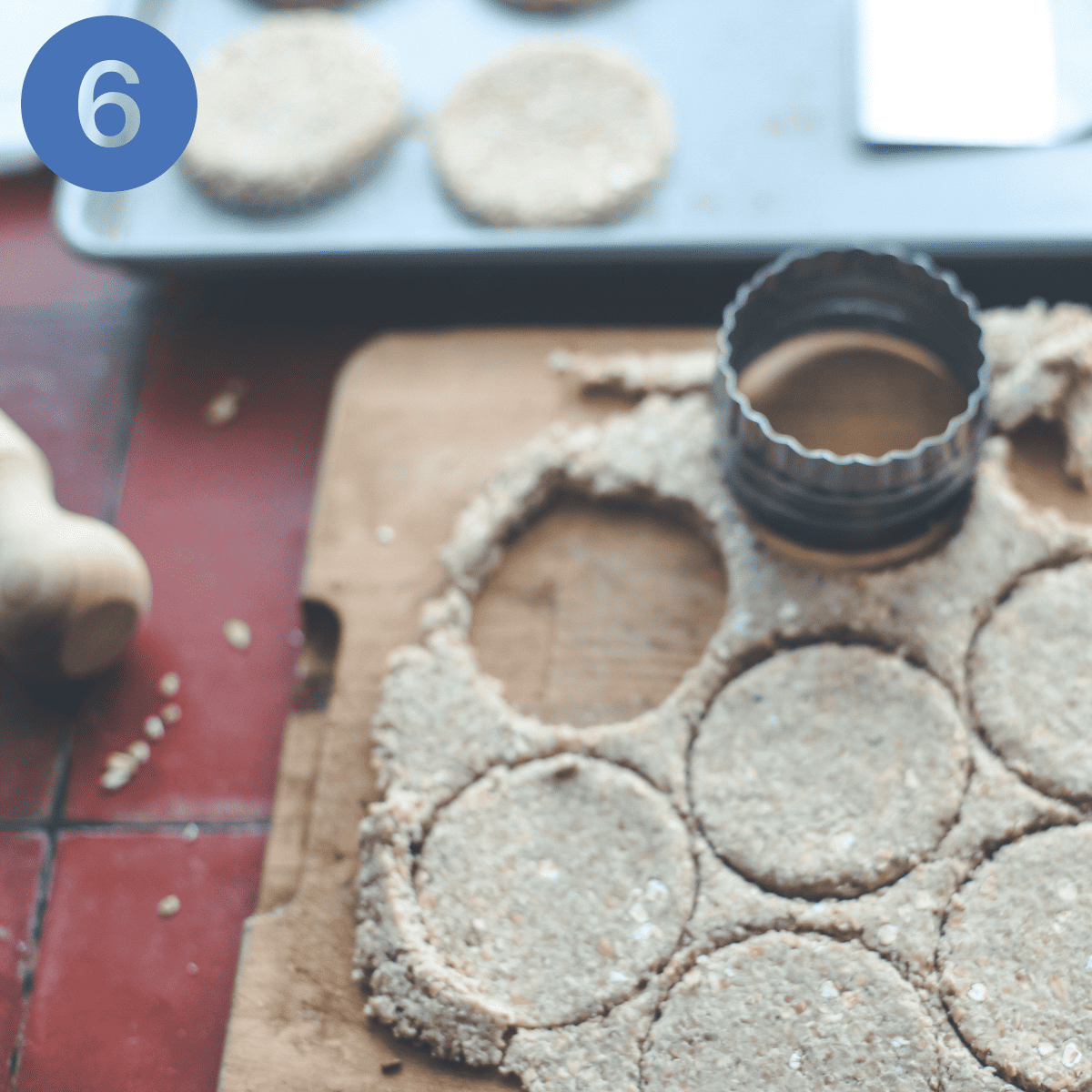 Cutting out oatcakes from the rolled out dough.